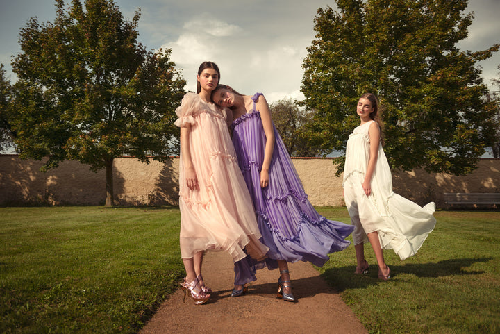2 GIRLS DRESSED IN SILK ORGANZA, VOILE AND CHIFFON GIRLISH DRESSES FLATTERING IN THE WIND. A KEY VISUAL OF A NEW NANICHE COLLECTION NYMPHAE SS2021 