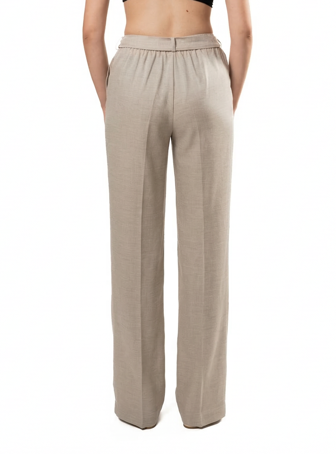 Woman wearing a beige high-waisted pants on a white background